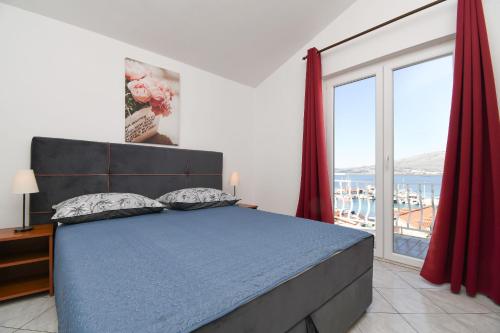 Posteľ alebo postele v izbe v ubytovaní Apartment Biserka