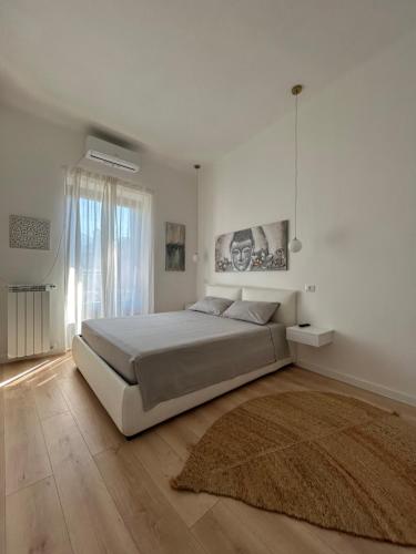 Postel nebo postele na pokoji v ubytování V&C HOME RENTAL SPECIALIST Appartamenti fronte Lago Maggiore