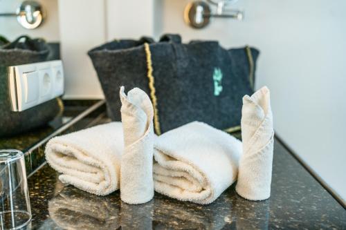a couple of towels sitting on a table at Berghotel Rehlegg in Ramsau