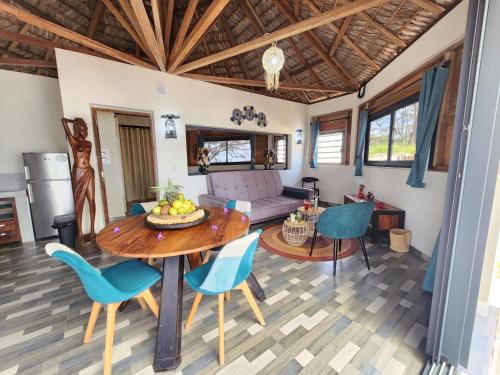 a living room with a table and chairs at Karibokite in Diego Suarez