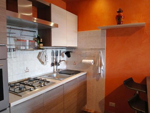 a kitchen with a sink and a stove at Villa Klinai in Cerveteri