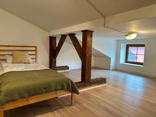 Ένα ή περισσότερα κρεβάτια σε δωμάτιο στο Cozy Cottage