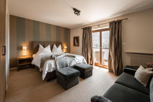 Postel nebo postele na pokoji v ubytování Hotel Chalet Gravenstein
