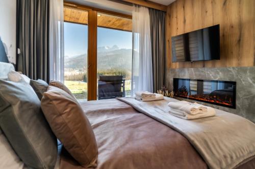 Ένα ή περισσότερα κρεβάτια σε δωμάτιο στο Apartament Natura Podhala by Apart Concept Podhale
