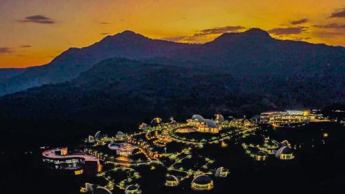 an aerial view of a resort with mountains in the background at Chebera Elephant Paw Lodge in Bokdē