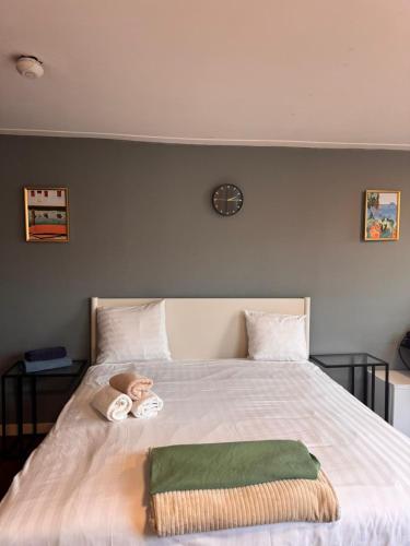 a baby doll laying on a bed with a blanket at Central B&B Apartment in Amsterdam in Amsterdam