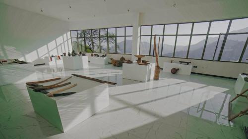 a large room with a group of objects on display at Chebera Elephant Paw Lodge in Bokdē