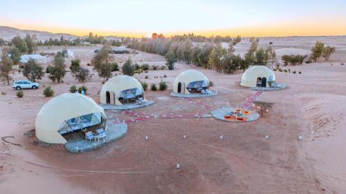an overhead view of four tents in a desert at Camels House in Merzouga