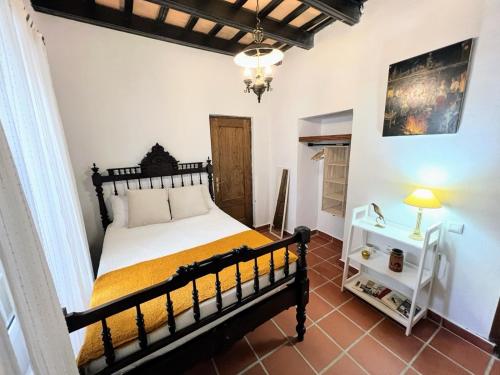a bedroom with a large bed in a room at La Posada de Zepeda in Jerez de la Frontera