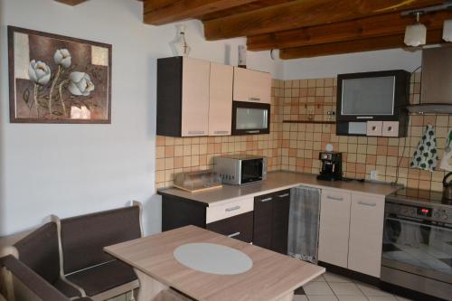 a kitchen with a table and a counter top at Dobre miejsce na Jurze in Kroczyce