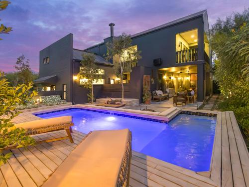 a swimming pool in the backyard of a house at The Royal Junction in Riebeek-Kasteel