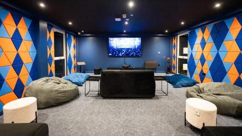 a room with two bean bag chairs and a tv at URBAN HUB Student Accommodation in Preston