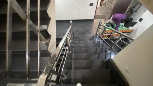 an overhead view of a person riding a skateboard down stairs at Strawbell Residency by YatriMap in Rishīkesh
