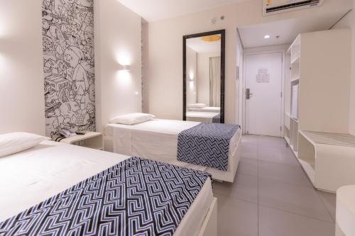 Ένα ή περισσότερα κρεβάτια σε δωμάτιο στο ibis Styles Boa Vista