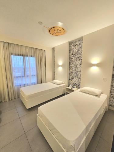 Ένα ή περισσότερα κρεβάτια σε δωμάτιο στο ibis Styles Boa Vista