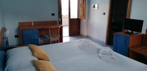 Una cama o camas en una habitación de Il Delfino