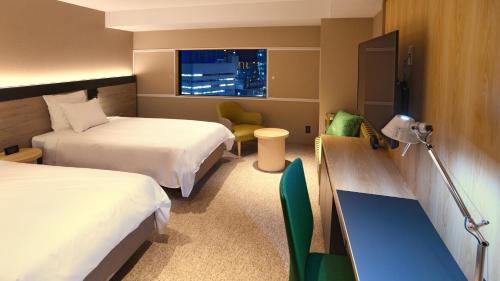 Postel nebo postele na pokoji v ubytování ANA Crowne Plaza Niigata by IHG