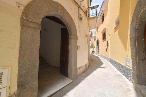 an alley with an archway in a building at Queen Suite - Luxury Rooms in Ischia