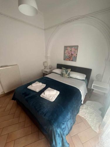Postel nebo postele na pokoji v ubytování Dimitra's apartament