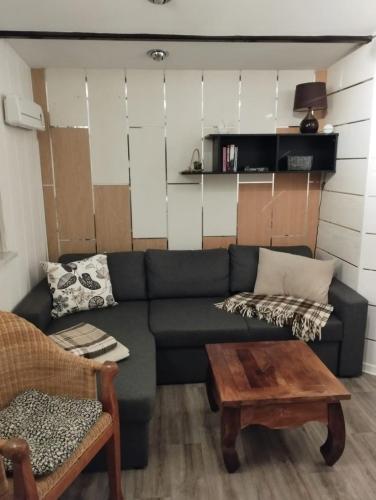 a living room with a couch and a coffee table at Ferienhaus Walddomizil in Neustadt-Glewe
