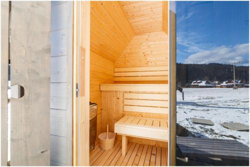 a sauna with a bench in a wooden cabin at Chalupa Purpurová lúka Velké Karlovice in Velké Karlovice