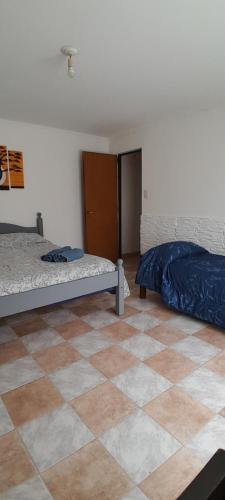 Una cama o camas en una habitación de Complejo Juli dpto TUCCI