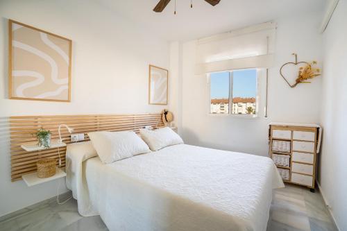 En eller flere senge i et værelse på Apartamento Torrox - Laguna Beach