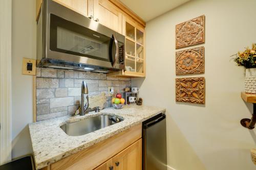 a kitchen with a sink and a microwave at Secluded Mtn-View Retreat in Mars Hill in Mars Hill