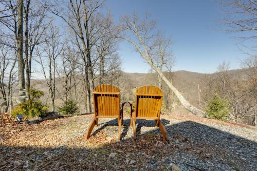 two wooden chairs sitting next to each other at Secluded Mtn-View Retreat in Mars Hill in Mars Hill