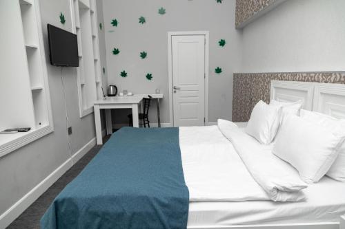 En eller flere senge i et værelse på Citadel Boutique Hotel