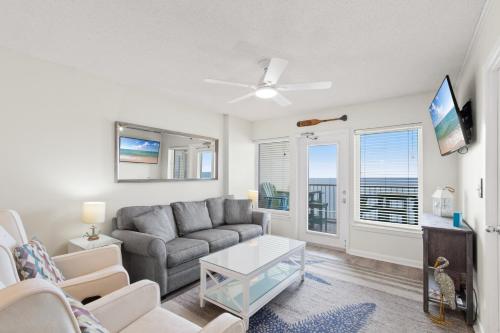 a living room with a couch and a table at Boardwalk 983 in Gulf Shores