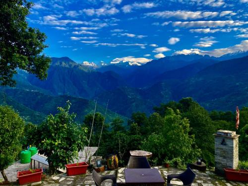 a view of the mountains from a house at MayaTels - Maya Eco Huts, Pelling in Pelling