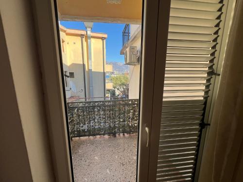 a sliding glass door with a view of a balcony at Guest House Plima 2 in Budva