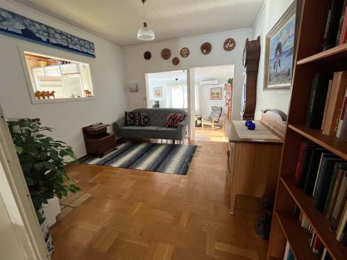 a living room with a couch and a table at Stuga Näsberget in Malung