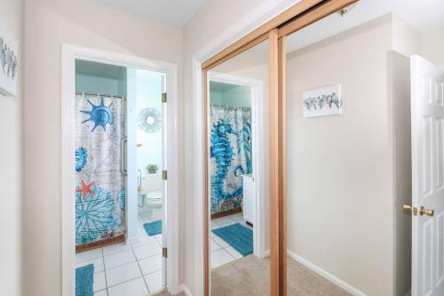 a bathroom with a shower and a toilet at Saltwater - Pet friendly, Waterfront! in Black Point Landing