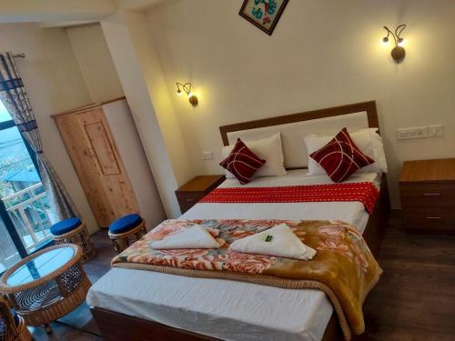Postel nebo postele na pokoji v ubytování Hotel Manjushree