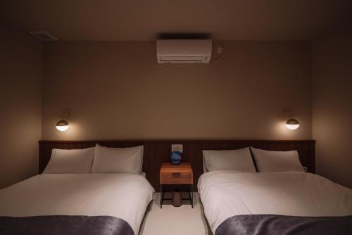 Postel nebo postele na pokoji v ubytování Reflexion Villas GLANZ by Relapool