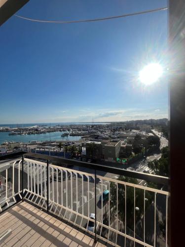 a view of the ocean from a balcony of a building at piazza Marconi Rooms in Manfredonia