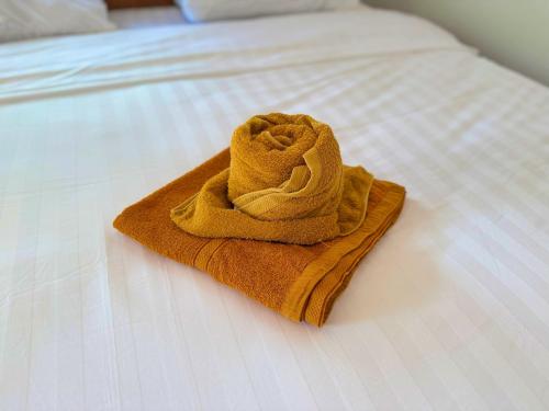 a towel sitting on top of a bed at Kohrong Central Beach in Koh Rong Island