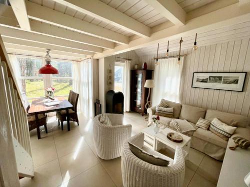 a living room with a couch and a table at Sandrose - Baabe in Baabe