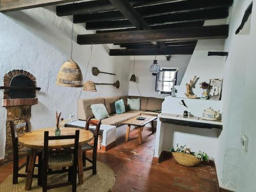 a living room with a couch and a table at Can Pep Frit in Ibiza Town