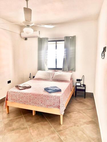 a bedroom with a bed in a room at La Villa Salma in Santa Bárbara de Samaná