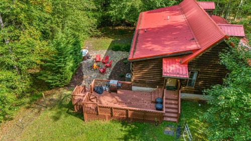 an overhead view of a house with a large deck at Hidden Pond by Carolina Mornings in Juno