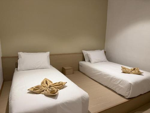 Postel nebo postele na pokoji v ubytování SWM Hotel