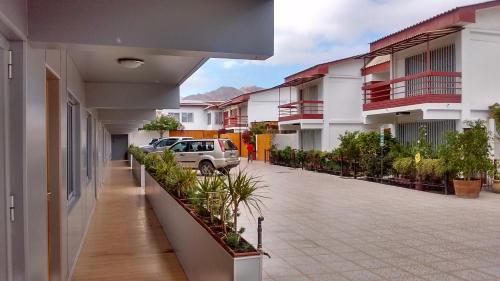 a car parked in the courtyard of a building at Vitrali Suite in Copiapó