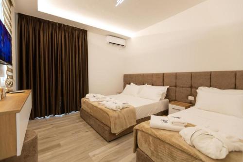 Ένα ή περισσότερα κρεβάτια σε δωμάτιο στο ZANI'S VILLA