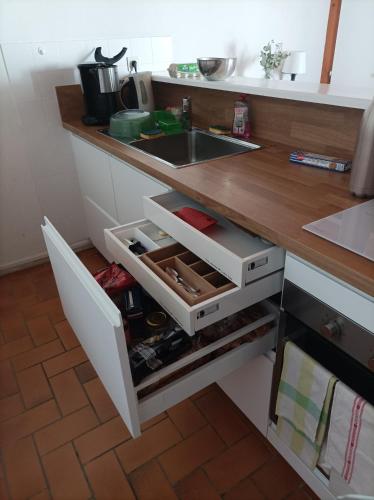 a kitchen counter with a sink and a drawer at Le Parc des Mimosas in Noirmoutier-en-l'lle