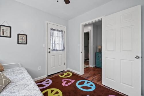 a living room with white walls and white doors at Serenity at Deep Hole Hideaway - Pet friendly! in Deep Hole