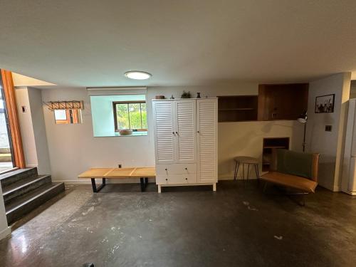 a living room with a table and a cabinet at The Church, Built in 1923 & 2 Blocks From Downtown in Bend