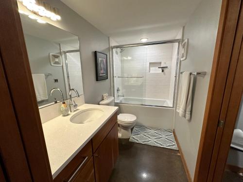 a bathroom with a sink and a toilet at The Church, Built in 1923 & 2 Blocks From Downtown in Bend